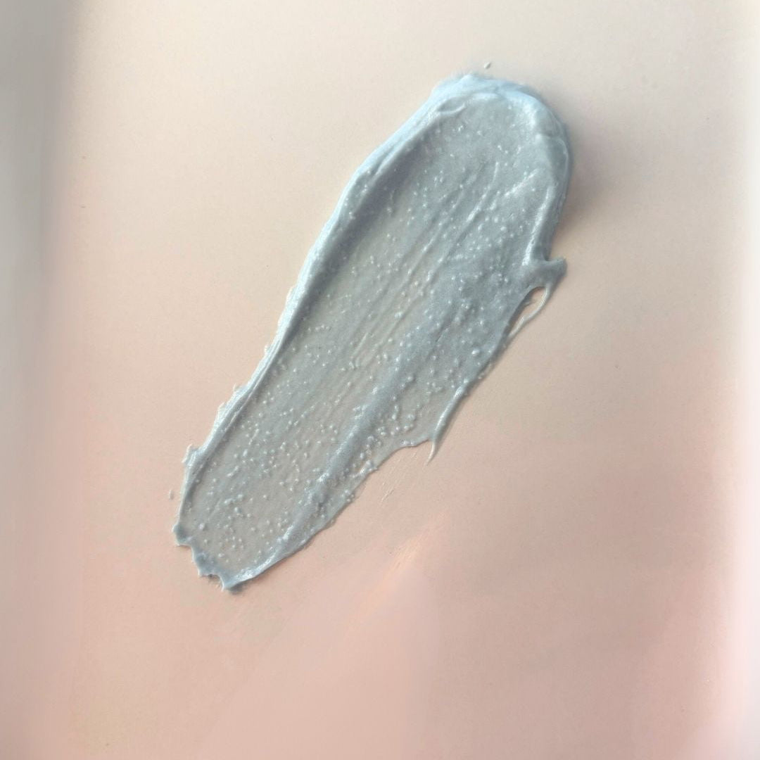 Close-up of a swatch of herbal whip on a beige background