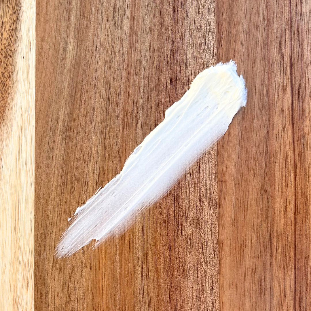 smear of whipped tallow on a wooden surface